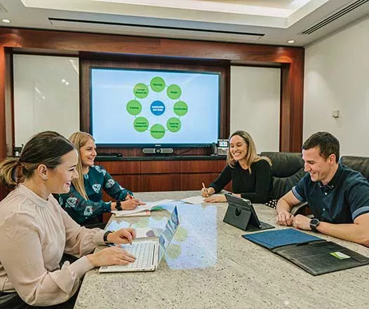 Premium meeting rooms in Servcorp were a meeting is being held.