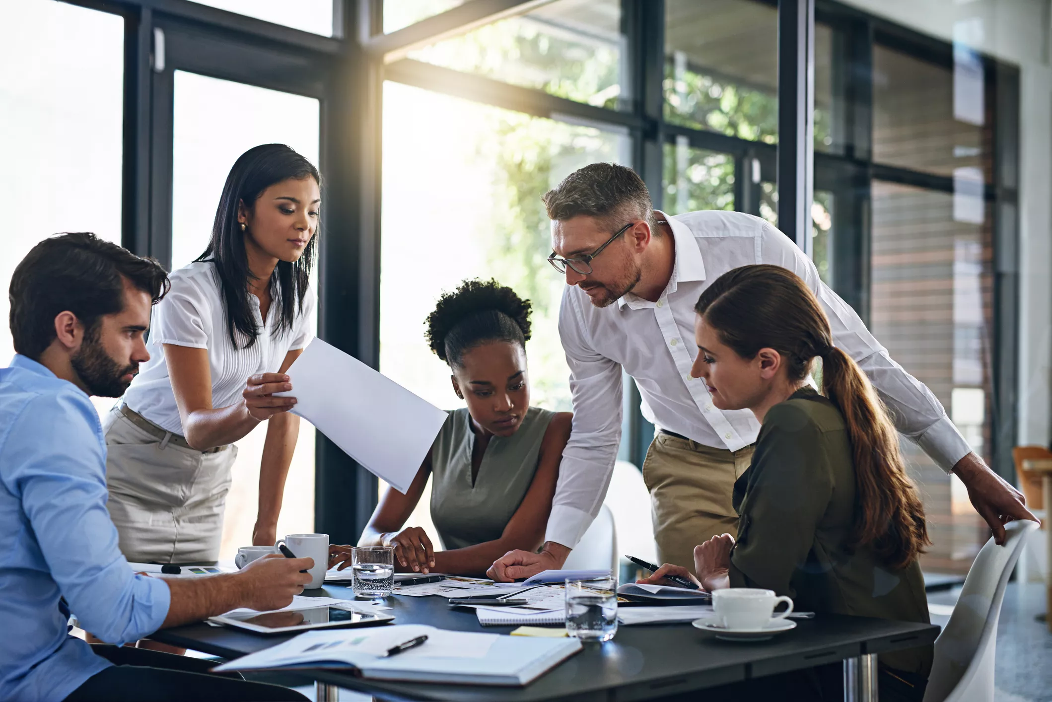 A team of professionals having a meeting and working together at a desk