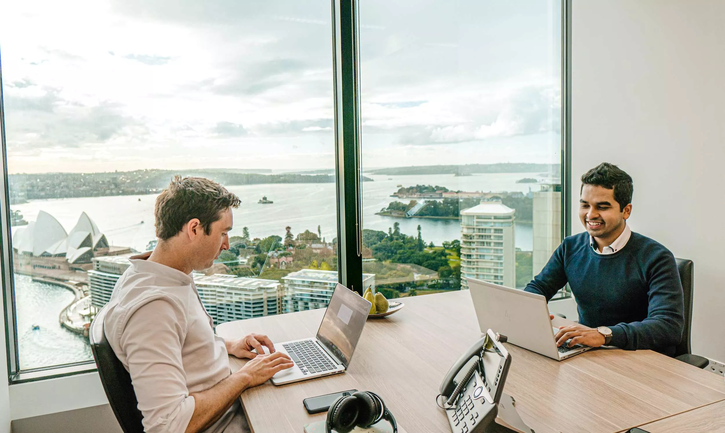 Clients working in a Servcorp Serviced Office with panoramic views.