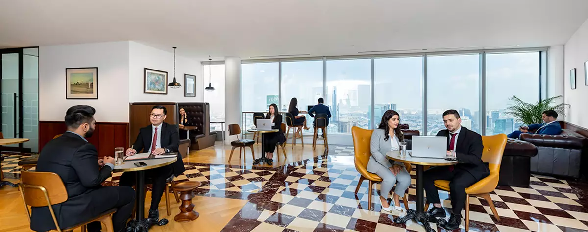 Premium coworking space in Emirates Towers, Dubai were everyone is working in a collaborative workspace 
