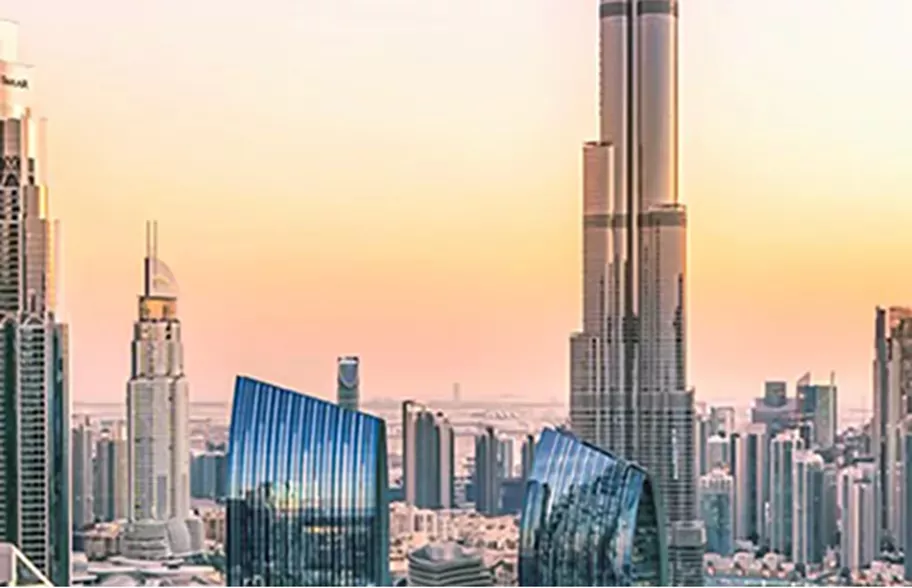 A stunning sunset view of Downtown Dubai with the Burj Khalifa rising above the skyline